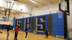 students playing basketball