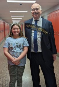 Retiring superintendent Joe Corr with student on his last day, Jan. 31.