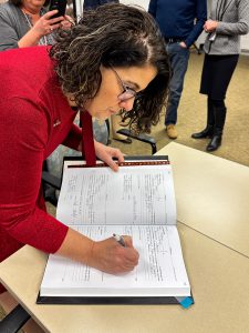 kathleen skeals signs the book of superintendents
