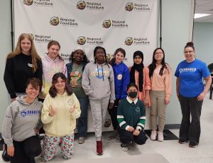 Shake Middle Students at food bank volunteering