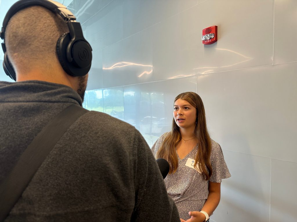 A student gets interviewed as part of the program.