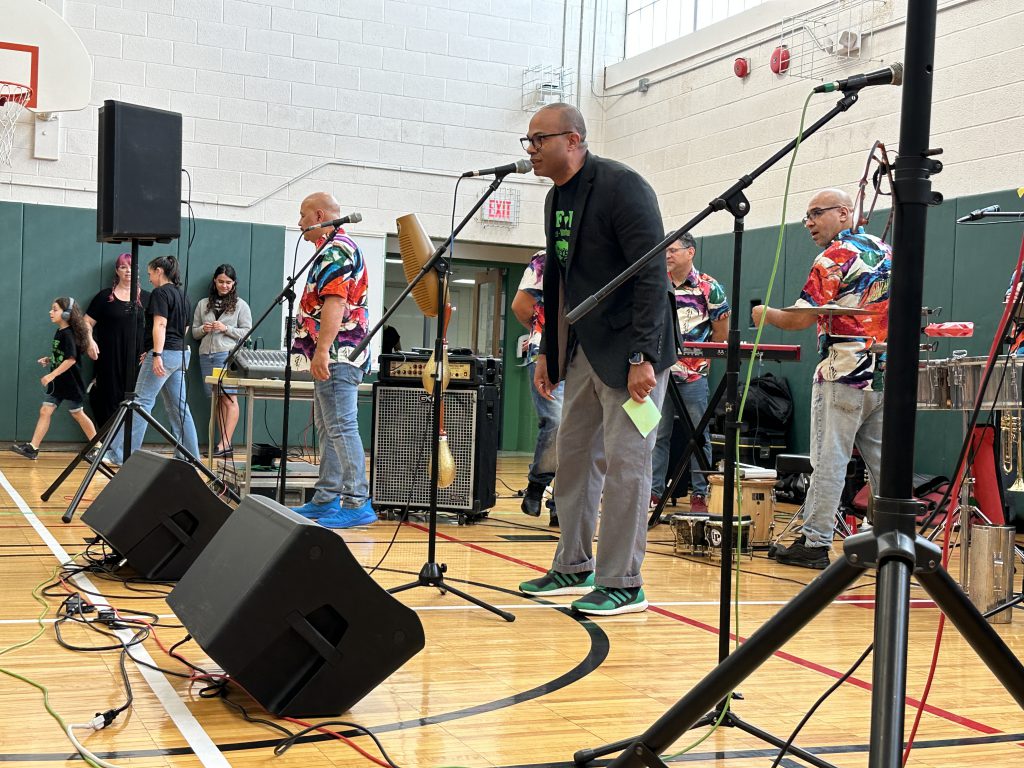 An image of Forts Ferry Principal Dr. Casey Parker on the mic.