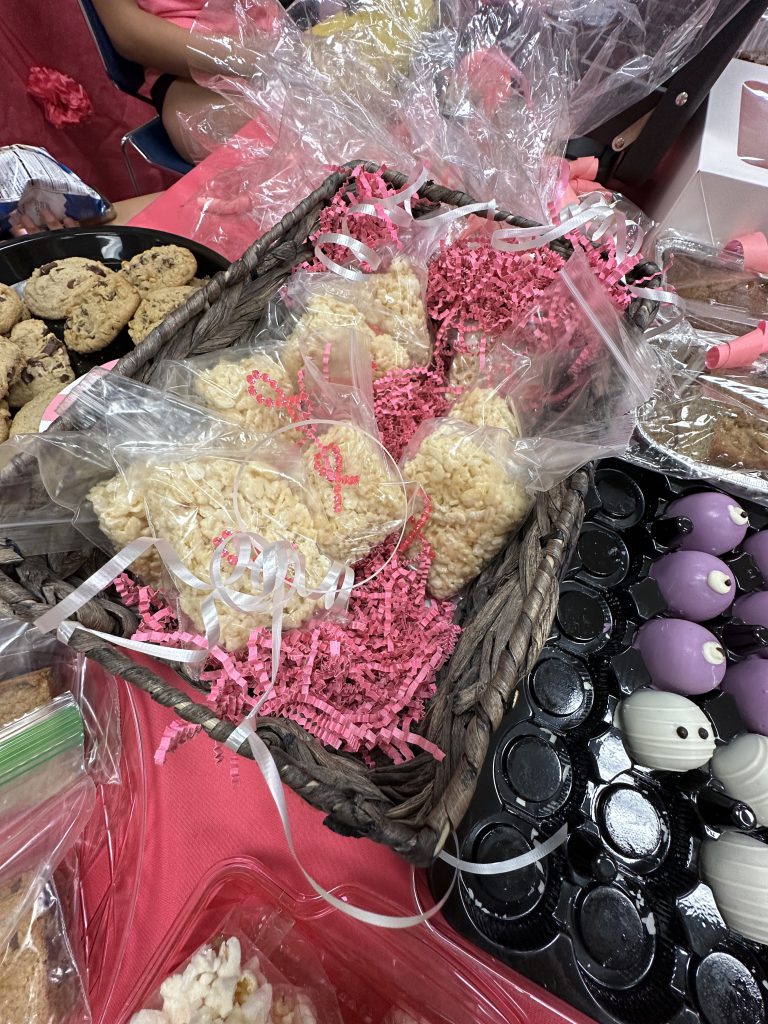 An image of treats decorated in pink that were sold to raise money during the game.
