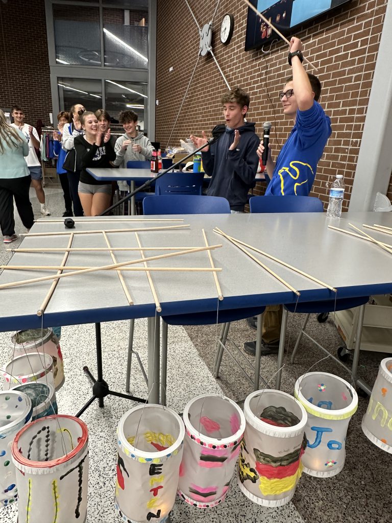 An image of two students presenting on the tradition of Martinstag.