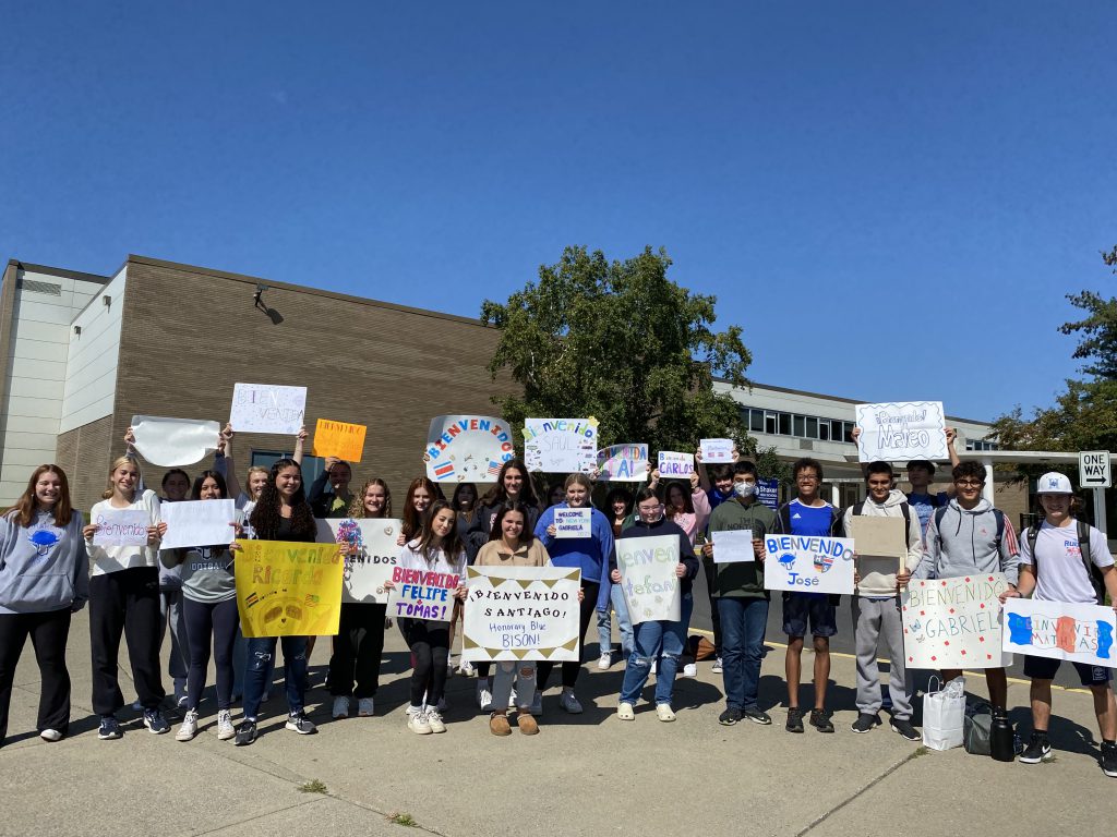 An image of Shaker students holding signs to welcome the Costa Rican exchange students.