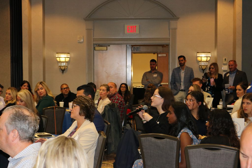 An image of attendees looking on at the Emerging Leaders Summit.