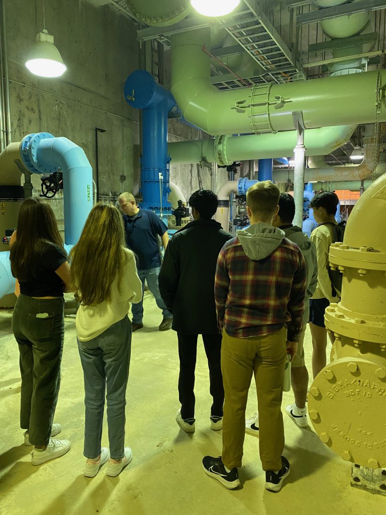 An image of the group of Shaker students looking on inside a plant.