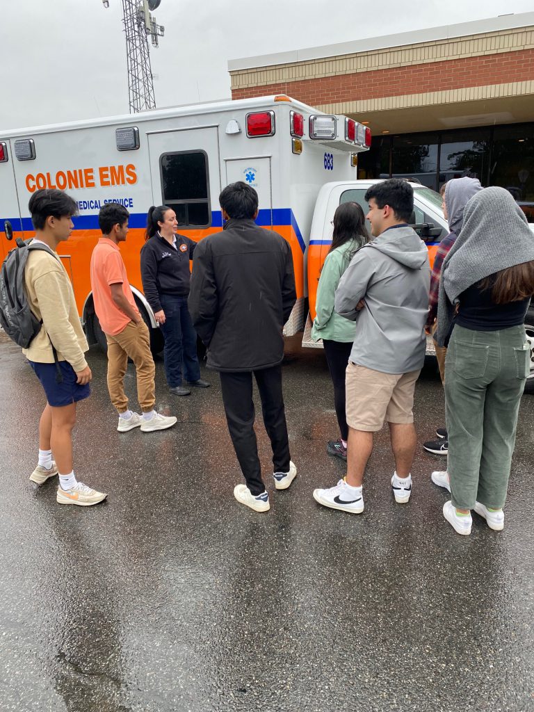 An image of a group of Shaker students learning from an EMT/medic.