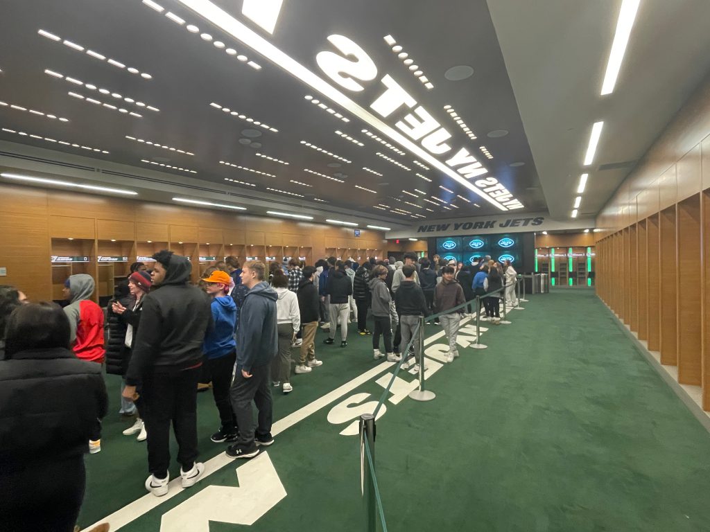 An image of the students inside the Jets locker room.