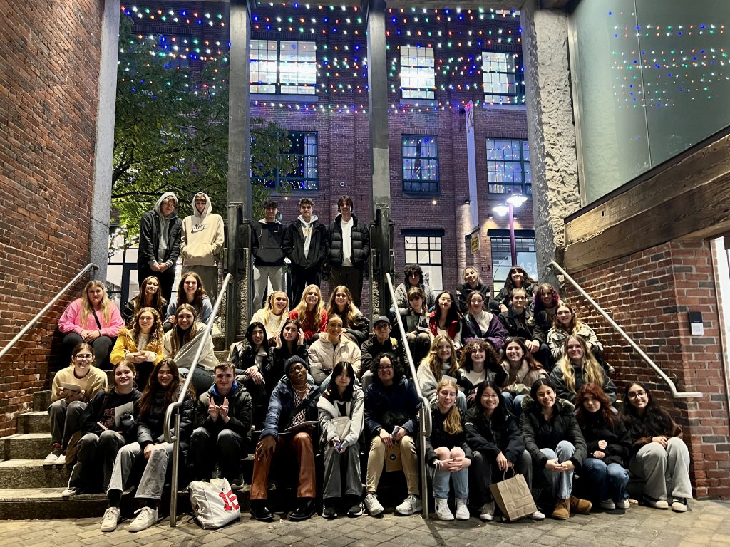 An image of the entire group of Advanced Art students, teachers and chaperones posing on steps in Boston.