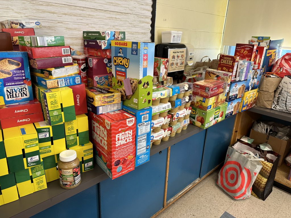 An image of snacks stacked on a counter in the food pantry.
