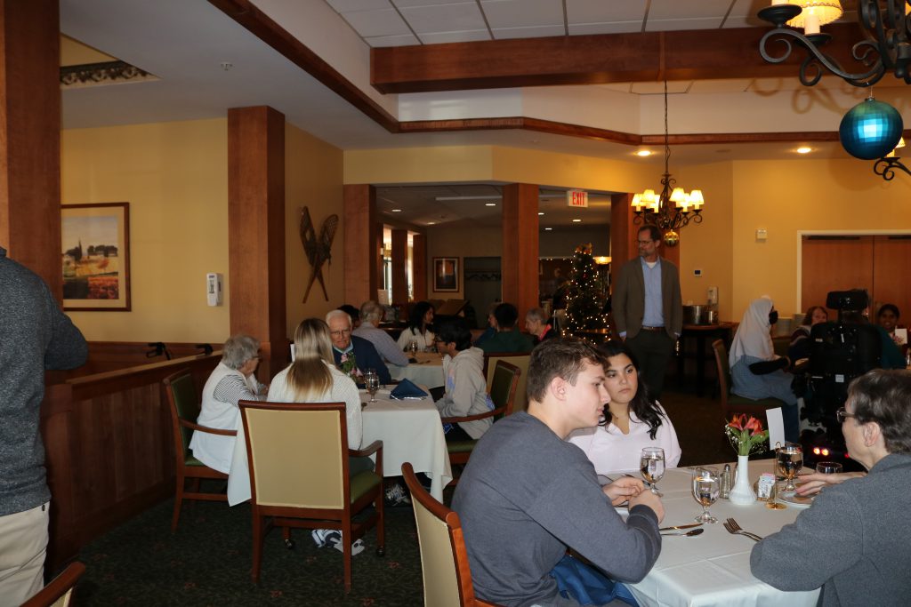 An image of the dining room filled with Shaker Students and their pen pals