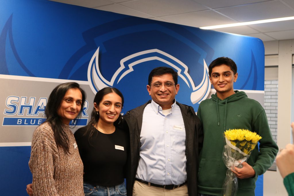 An image of Shaker student Ayush Patel posing with his mother, father and sister.