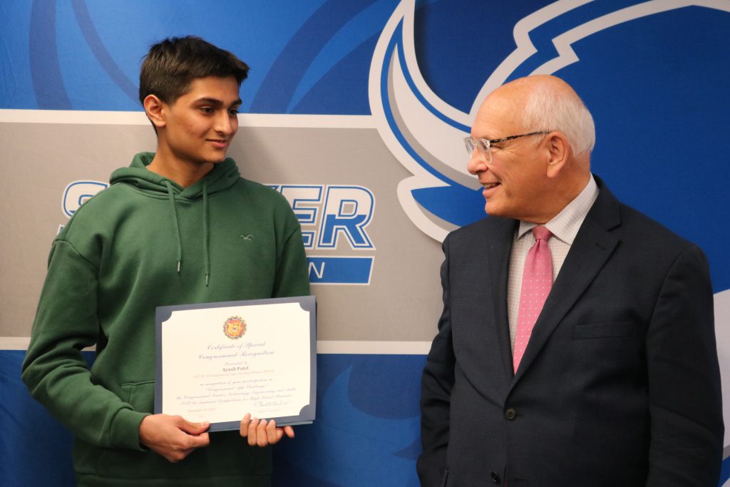 An image of Congressman Paul Tonko chatting with one of the app challenge winners.