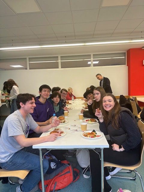 An image of students sharing a meal together.